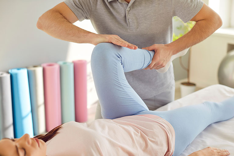 Female athlete getting sports massage.